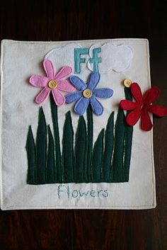 a close up of a piece of cloth with flowers on it and the words fff