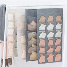 an organized closet with shoes and socks hanging on the wall next to a potted plant