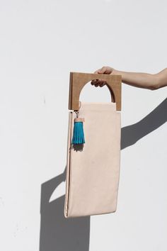 Meet The Line Of Made-To-Order Bags That Tan With You+#refinery29 Building Block Bag, Waka Waka, Wooden Bag, Geometric Fashion, Minimalist Bag, Building Block, Bag Handle, Diy Bag, Beautiful Bags