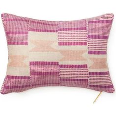 a pink and white pillow with stripes on it