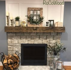 a living room with a fire place and fireplace mantels on top of it