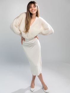 Handmade white fluffy mohair cardigan with an airy, light texture and balloon sleeves. Crafted from cruelty free Kid Mohair and Silk, the cardigan is soft as a cloud and light as air. The balloon sleeves create a flattering and stylish silhouette, while the delicate white color is perfect for any occasion. Whether you're dressing up for a night out or simply want to add a touch of elegance to your everyday wardrobe, the white mohair cardigan is the perfect finishing touch. This product is aligne Luxury White Wool Tops, Luxury Wool Sweater With Soft Texture, White Yarn Sweater, Sleevless Wedding Dress, Handmade Knitwear, Fluffy Sweater, Mohair Cardigan, Alpaca Sweater, Mohair Wool