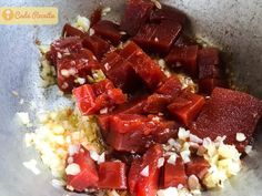 chopped up food in a bowl on top of a table