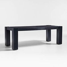 a black table sitting on top of a white floor