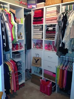 the closet is full of clothes and other things to wear in it's storage area