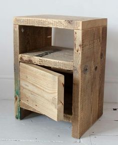 a small wooden table with two drawers