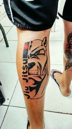 a person with a tiger tattoo on their leg and the words life is short written in black ink