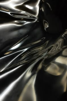 an image of shiny material that is very dark