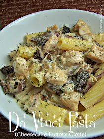 pasta with chicken, mushrooms and herbs in a white bowl on a brown tablecloth