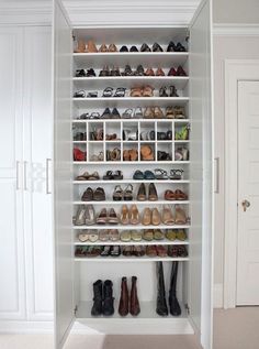 a white closet filled with lots of shoes