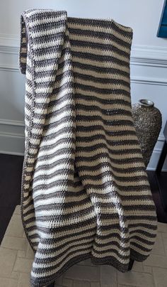 a blanket that is sitting on top of a chair