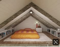 an attic bedroom with a bed and bookshelves