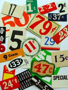 many different price tags and numbers on a white surface