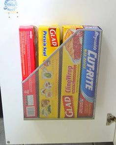 a white refrigerator freezer sitting inside of a kitchen next to a shelf filled with food