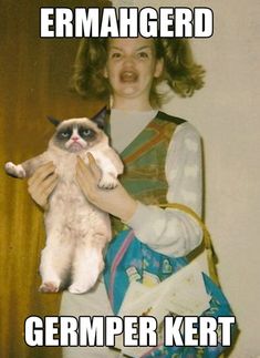 a woman holding a cat in her arms and captioned with the caption grumper kert