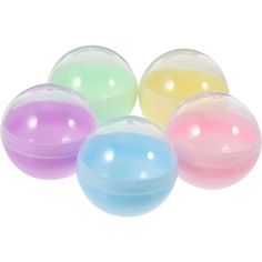 four different colored balls sitting next to each other