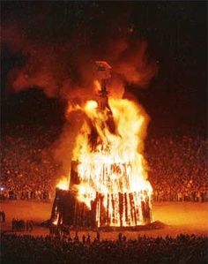 a large fire in the middle of a stadium