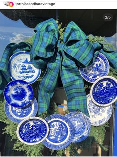 a wreath with blue and white plates on it