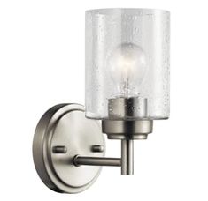 a wall light with a glass shade on it