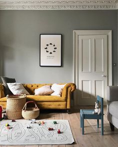 a living room with grey walls and white trim on the walls is featured in instagram