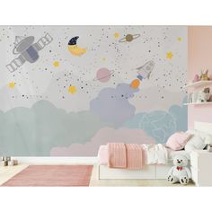 a child's bedroom decorated in pink, blue and white with space themed wallpaper