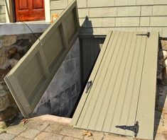 an open door on the side of a house that has been partially opened to reveal a ramp