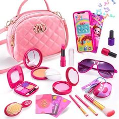 the contents of a barbie doll's pink purse, sunglasses, and other accessories