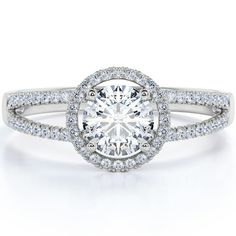 a white gold engagement ring with round cut diamonds