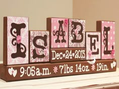 a wooden block that says sale decorated with pink flowers