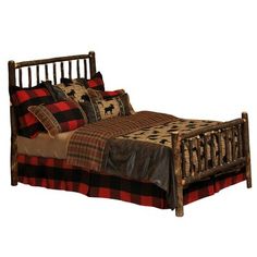 a bed with red and black plaid sheets