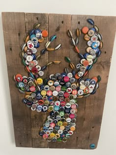 a bottle cap deer made out of beer caps on a pallet with wood planks