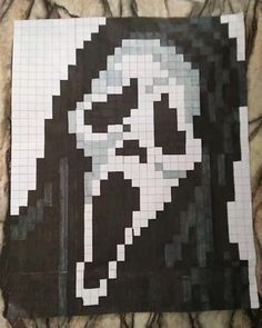 a close up of a piece of art made out of legos and black and white squares