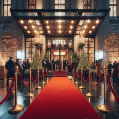 a red carpeted entrance to a hotel with people standing outside the doors and onlookers