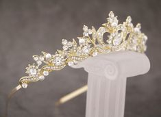 "Gold Bridal Tiara, Wedding Tiara, Gold Bridal Crown, Gold Leaf Crown, Rhinestone Crown, Bride Tiara, Gold Tiara This elegant and sparkle rhinestone Tiaras is perfect for your wedding or formal night out. This Tiaras is flexible. It will be perfect for the bride. The Metal Headband measured approx. 14\" long. The rhinestone part of the headband is about 7.25\" long and the center is 1.5\" high. Tone color: Silver tone, Gold tone and Rose gold tone. Pearl color : Swarovski white pearl and Ivory p White And Gold Crown, Simple Tiara, Gold Tiara Wedding, Reception Hairstyle, Gold Bridal Tiara, Gold Leaf Crown, Gold Bridal Crowns, Prom Tiaras, Crown Bride