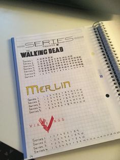 a calendar with writing on it sitting next to a computer keyboard and mouse, along with the words walking dead written in cursive