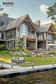 A luxurious waterfront estate with grand architecture, large windows, and a private dock, set against a serene lakeside backdrop, offering stunning views and elegant outdoor living spaces. Grand Architecture, Lakeside Living