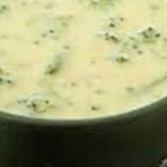 a pot filled with soup sitting on top of a stove