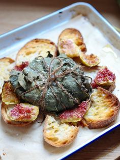 an artichoke is sitting on top of bread