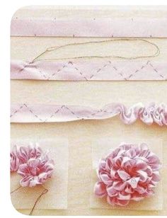 three pieces of fabric with pink flowers on them and one piece of white ribbon in the middle