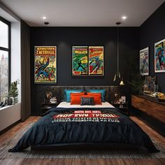 a bedroom with black walls and posters on the wall above the bed, along with wooden flooring