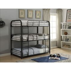 a bunk bed with three sets of mattresses on the bottom and one set below