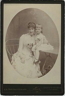 an old photo of two women and a baby