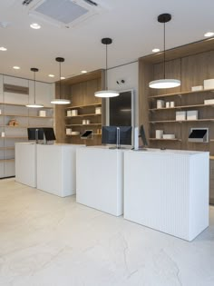 the interior of a store with white counter tops