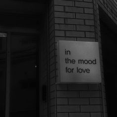 a sign on the side of a building that says, in the mood for love