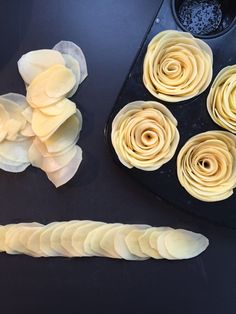 some food is laying out on a black counter top and ready to be cut into pieces