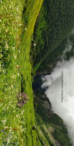 an aerial view of the mountains and clouds