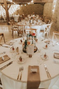 the table is set with silverware and place settings for an elegant wedding reception or special event