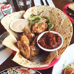 mexican food is served on tortillas with sauces