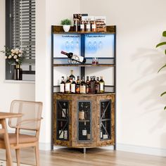 a wooden shelf with bottles on it in the middle of a room next to a table