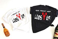 two t - shirts with lobsters on them next to a bottle of booze